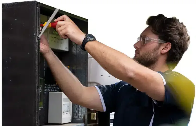 Local electrician working on a switchboard